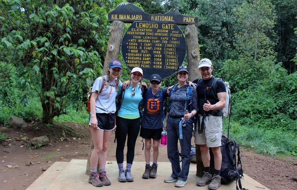 Trekkers on Kilimanjaro Lemosho Route through lush rainforest on Day 1