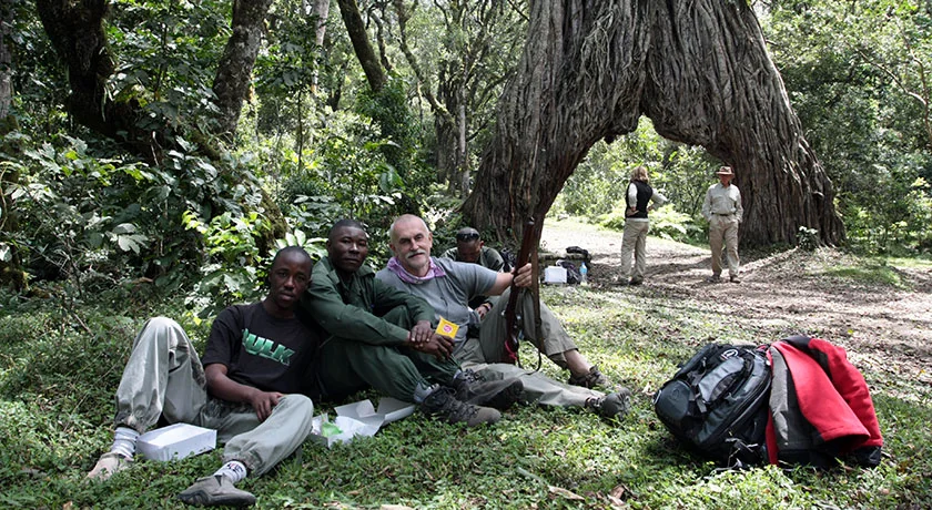 A guide and visitors taking a break during a Tanzania trip