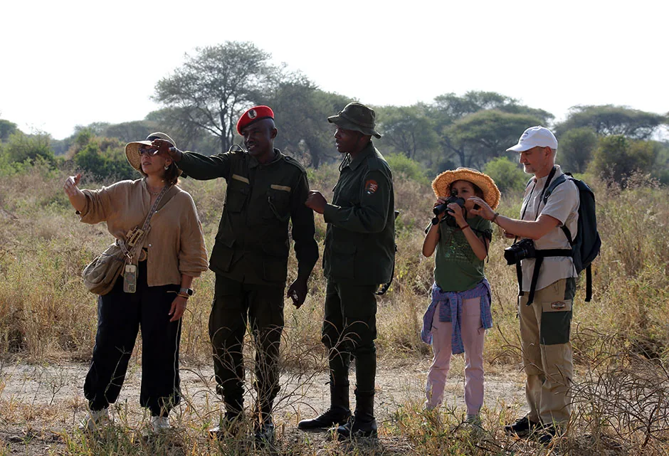 Walking safari with an armed ranger through the Tanzanian bush