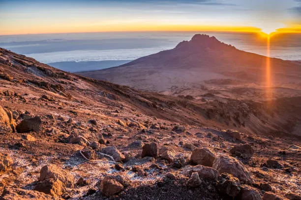 Panoramic view of the Kibo and Mawenzi volcanoes above the clouds on Mount Kilimanjaro